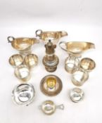 A large collection of silver, including three gravy boats, a pierced and engraved repoussé sugar