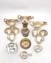 A large collection of silver, including three gravy boats, a pierced and engraved repoussé sugar