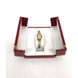 A ladies Art Deco 9ct yellow gold Rolex automatic watch with rolled gold curricular link bracelet.
