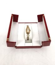 A ladies Art Deco 9ct yellow gold Rolex automatic watch with rolled gold curricular link bracelet.