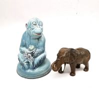 An Art Deco Beswick blue glaze monkey holding a fruit along with a Beswick elephant. Tallest H.19