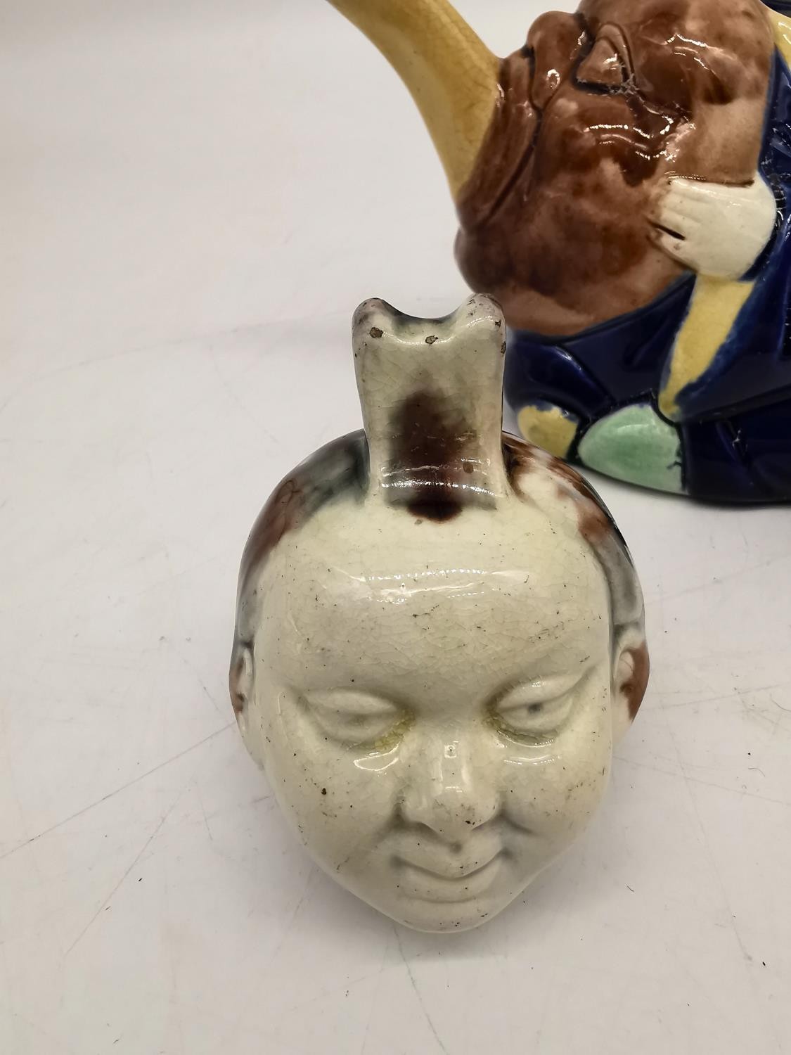 A 19th century Minton Majolica teapot of an oriental china man in cobalt robe, holding a Noh mask - Image 2 of 10