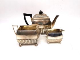 A Victorian gadroon sterling silver matching three piece silver tea set, each piece sitting on