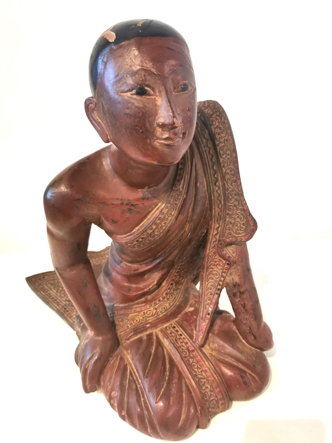 A 19th/early 20th century carved and lacquered Burmese kneeling figure of a monk wearing a robe. The - Image 4 of 10