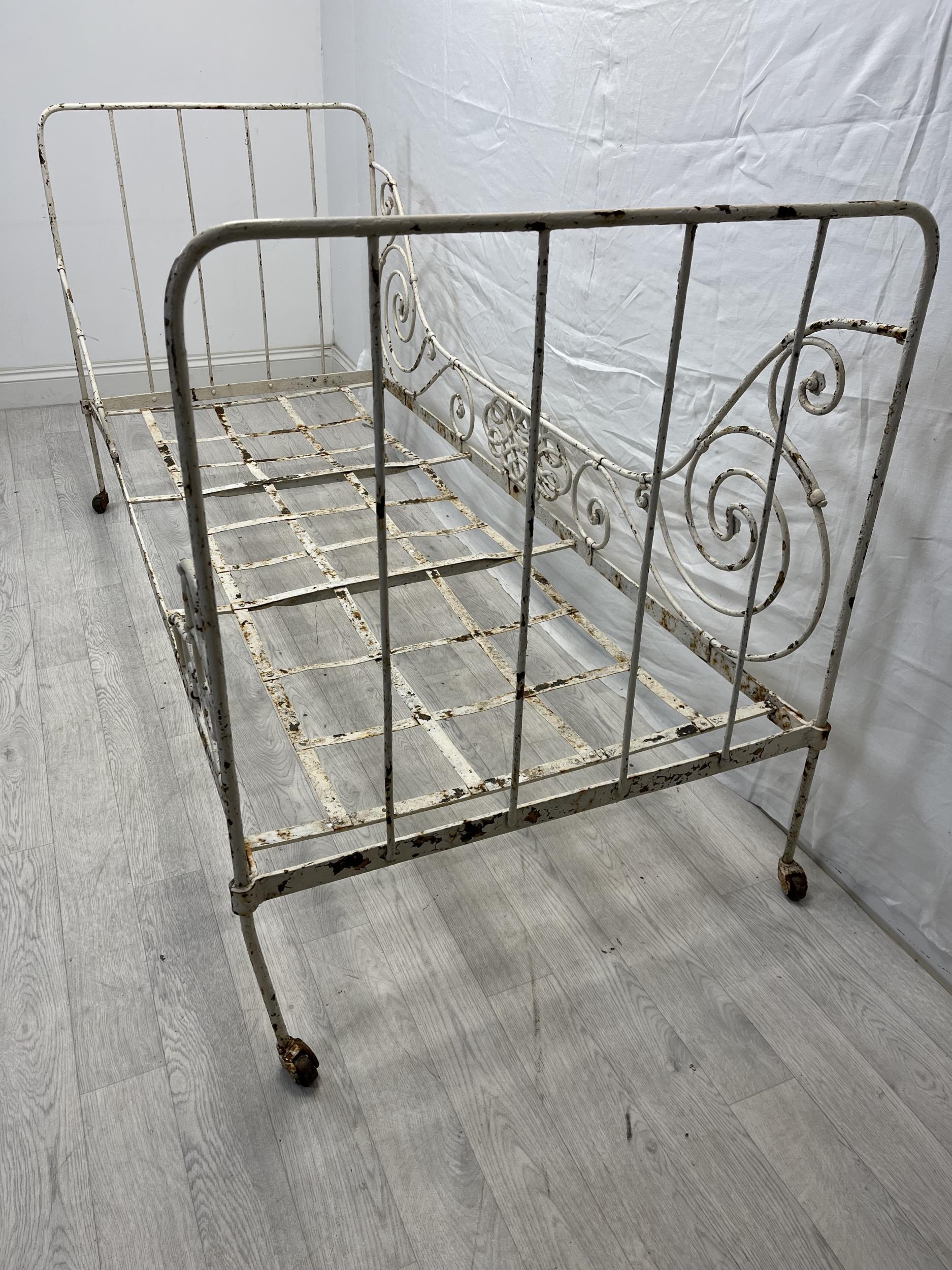 A Victorian painted metal folding single bedstead. H.96 W.184 D.79cm. - Image 5 of 6