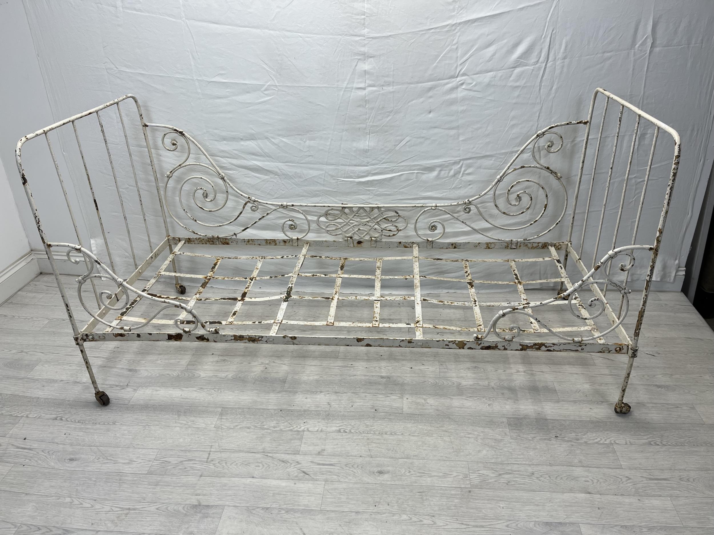 A Victorian painted metal folding single bedstead. H.96 W.184 D.79cm.