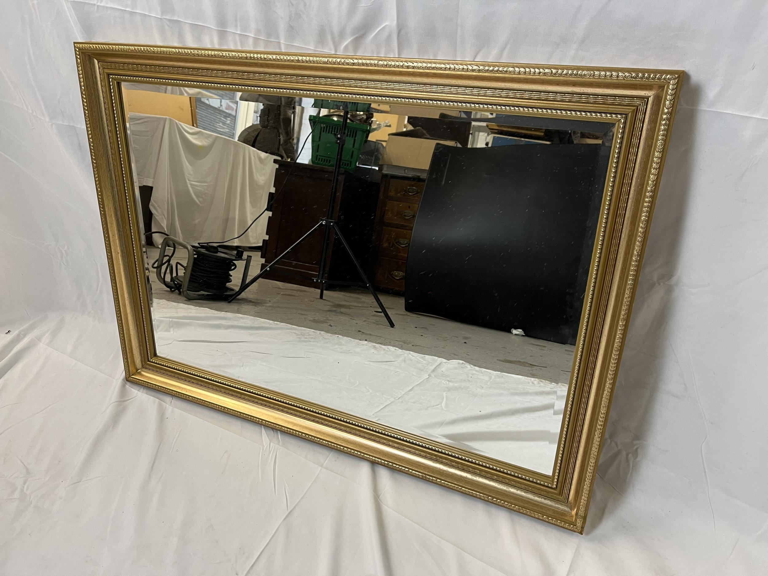 A contemporary gilt mirror with bevelled plate. H.61 W.84cm. - Image 2 of 4