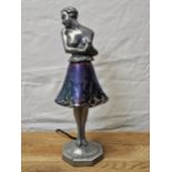 An Art Deco spelter and iridescent glass table lamp, signed Brevete to the base. H.34cm.