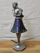 An Art Deco spelter and iridescent glass table lamp, signed Brevete to the base. H.34cm.