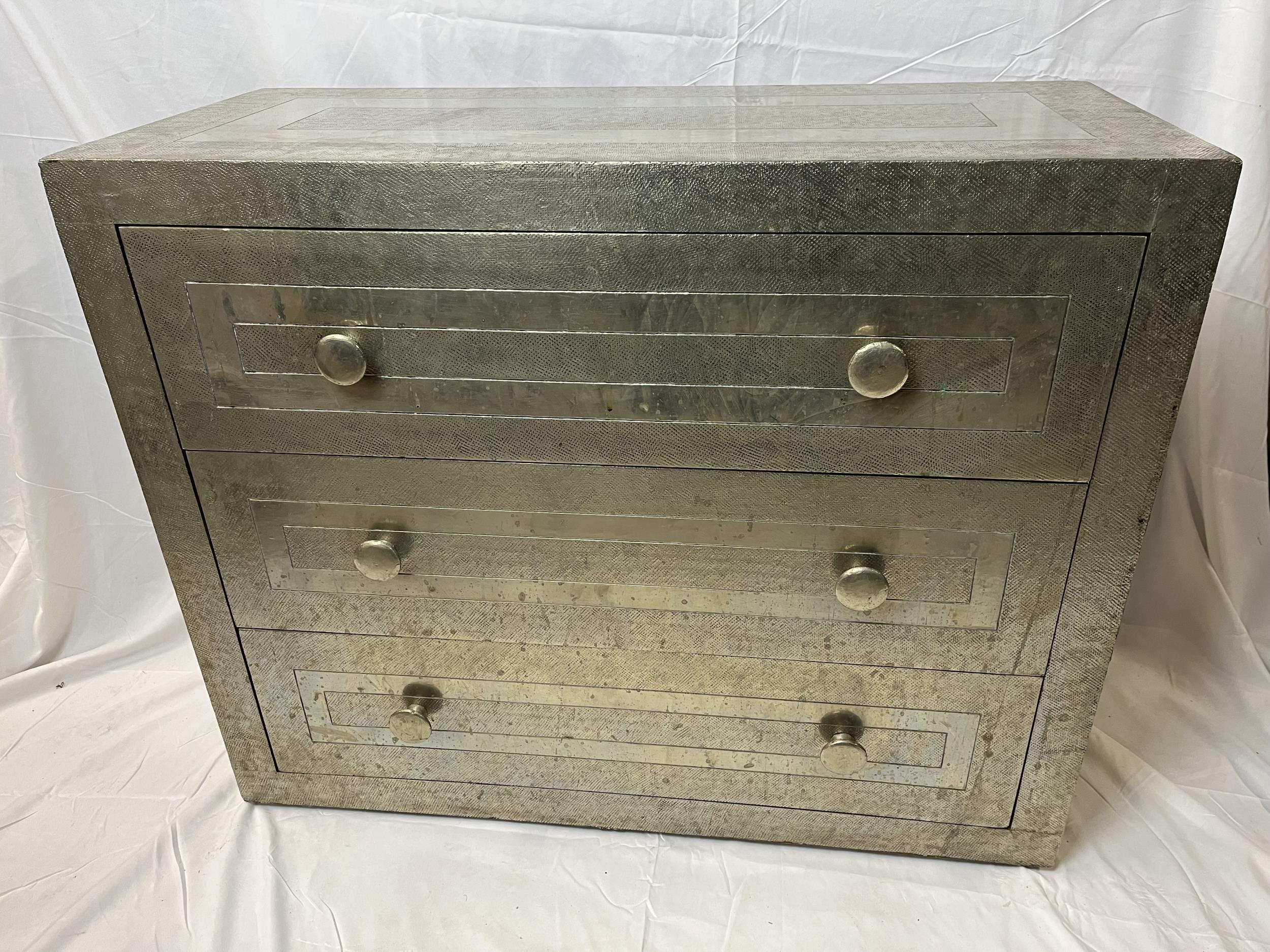 A contemporary metal bound chest of drawers. H.74 W.92 D.40cm.