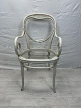 A late 19th century painted Thonet style armchair with scrolling arms and heart motif to the back.
