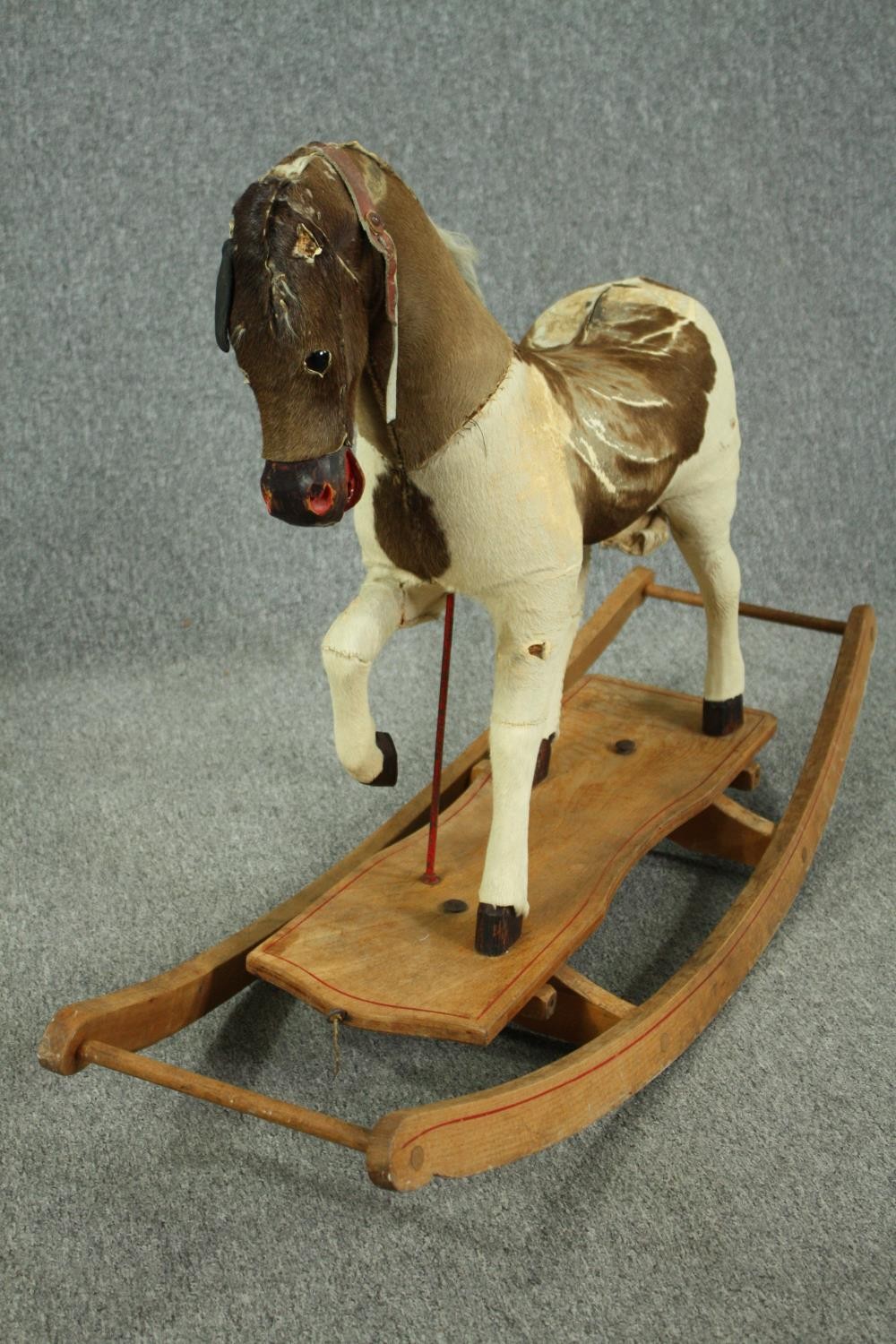 A vintage rocking horse in cowhide covering. H.74 W.110 D.38cm. - Image 4 of 14