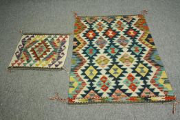 A Chobi Kelim rug with allover geometric pattern along with a smaller example. L.120 W.79cm. (