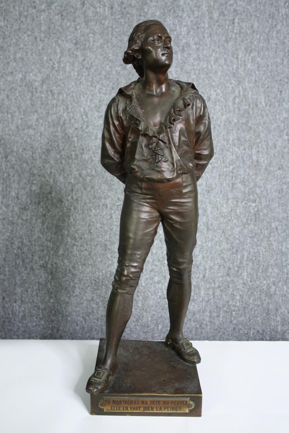 After Eutrope Bouret (1833-1906), a C.1900 patinated bronze figure of a prisoner. H.56cm.