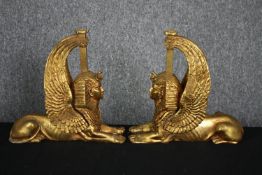 A pair of painted gilt sphinxes. H.21cm.