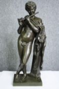 A 19th century patinated bronze figure, Classical style flautist. H.54cm.