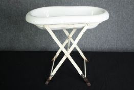 A late 19th century French porcelain baby or footbath on metal stand. H.44 W.50 D.29cm.