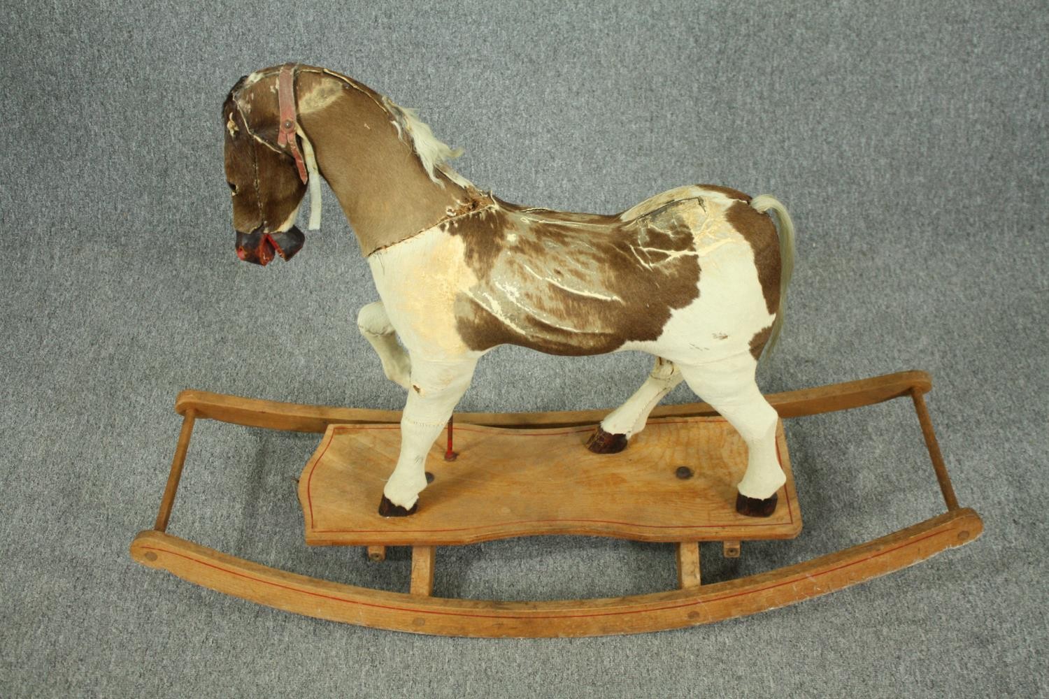 A vintage rocking horse in cowhide covering. H.74 W.110 D.38cm. - Image 2 of 14