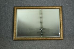 A contemporary gilt framed wall mirror. H.74 W.103cm.