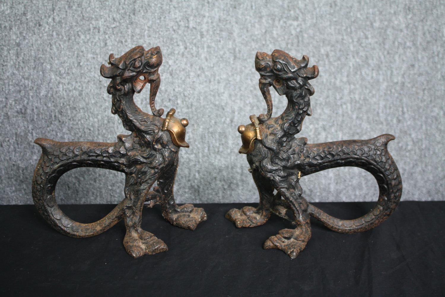 A pair of 19th century cast iron boot scrapers in the Chinese taste formed of chimeras. H.24cm. (