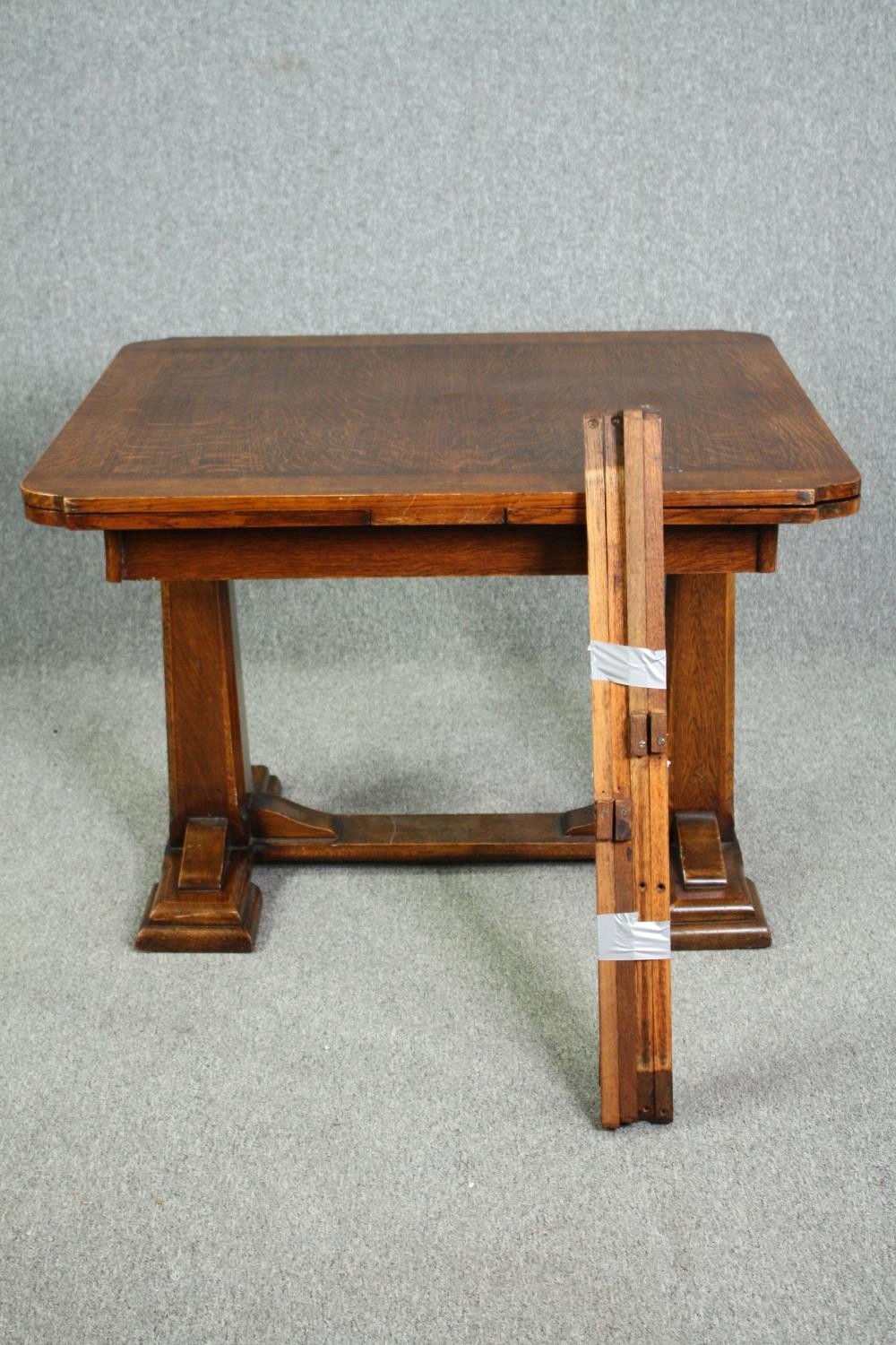Dining table, mid century oak, draw leaf action. H.76 W.172. (ext) D.91cm. (In need of repair). - Image 2 of 9