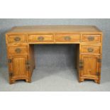 A Chinese elm three part pedestal desk of slightly curved outline. H.86 W.148 D.70cm.