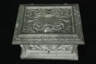 Dressing table box in a Classical design repousse metal alloy. H.13 W.18 D.14cm.