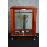 A set of late 19th century laboratory scales in a mahogany case with Vertling maker's label. H.49