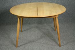 Extending dining table, contemporary light oak and beech Ercol style with integral leaf. H.75 W.
