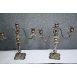 A pair of silver plated three branch table candelabras. H.42cm. (each)