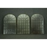 A set of three distressed metal framed window pane garden mirrors. H.80 W.50cm. (each)