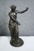 An early 20th century spelter figure, Classical style female, signed to the base. H.38cm.