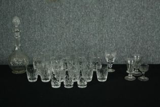 A collection of cut crystal and other glass along with a decanter and stopper. H.33cm. (Largest)