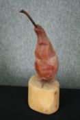 Contemporary art, a carved and painted pear. H.34cm.