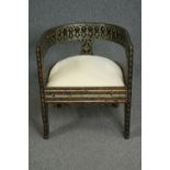 Tub armchair, Eastern hardwood with embossed metal decoration. H.69 W.62 D.62cm.