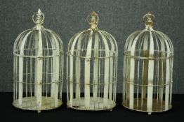 Three painted distressed metal cages. H.51cm. (each)
