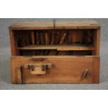 A vintage carpenter's toolbox fitted with chisels and saws etc. H.45 W.70 D.26cm.