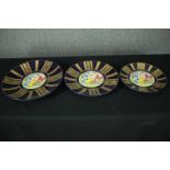 A set of three graduating Continental style plates. Dia.41cm. (largest)