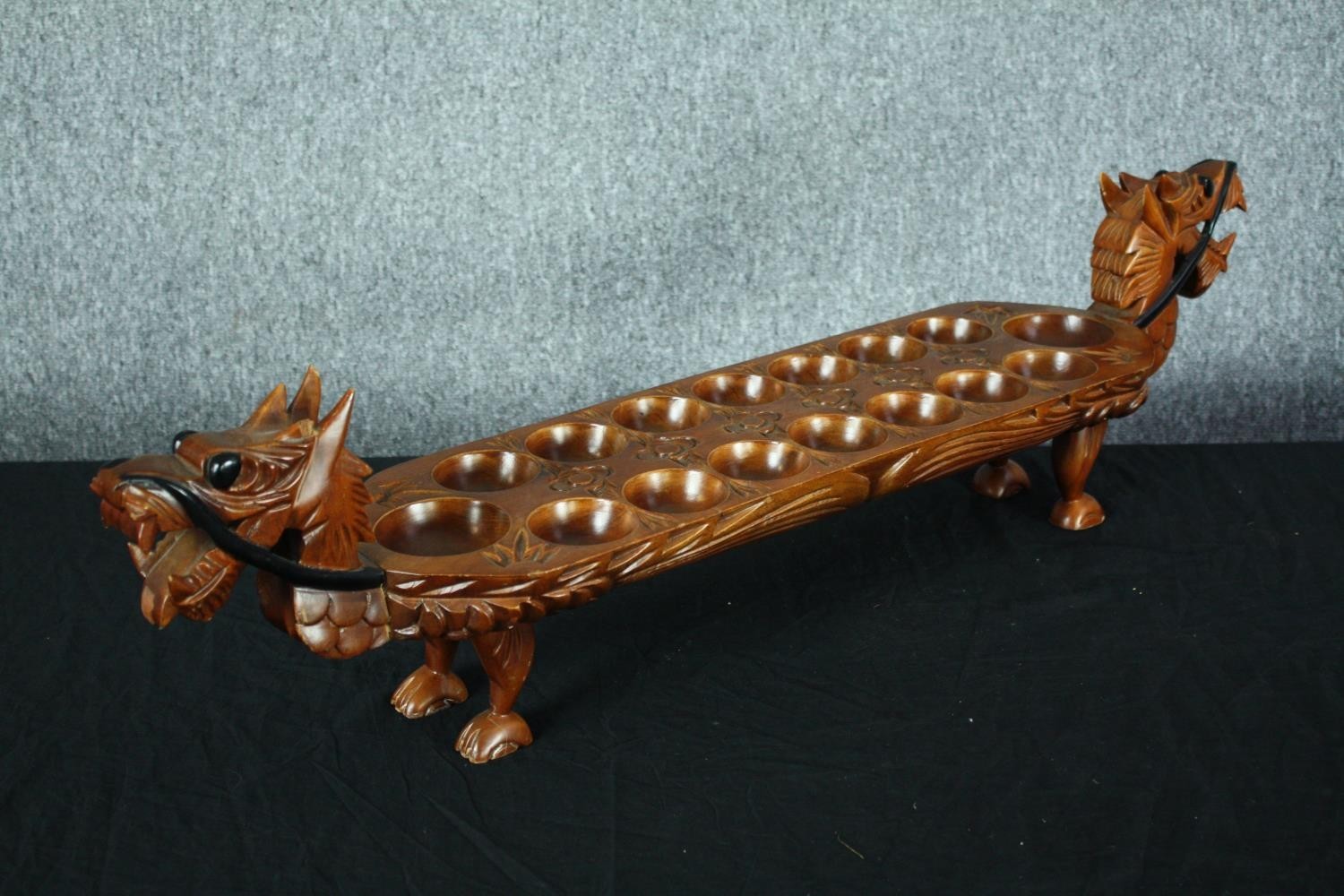 A hardwood decorative Mancala board game in the shape of a dragon. With carved decoration and - Image 2 of 5