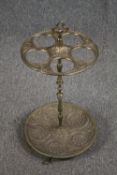 A vintage brass umbrella stand along with a miniature brass Rococo screen and two desk stands. H.