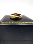 An 18ct tri-gold Russian wedding band. Stamped 750, Arona assay marks. Ring Size I 1/2. Weight 4.
