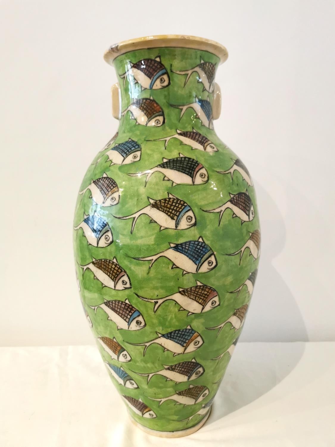 A large twin handled Persian Iznik ceramic vase with green ground and painted fish. H.54 D.25cm. - Image 6 of 12