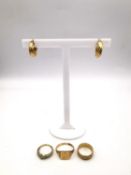 A collection of 9ct jewellery, including three 9ct gold rings and a pair of wreath hoop earrings