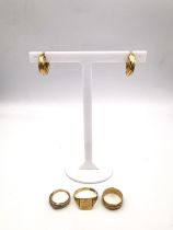 A collection of 9ct jewellery, including three 9ct gold rings and a pair of wreath hoop earrings