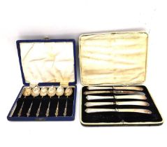A leather cased set of six apostle design silver coffee spoons by Barker Brothers Silver Ltd and