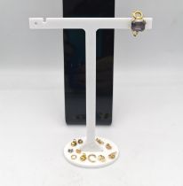 A collection of scrap gold, including an 18ct carat yellow gold and amethyst clip earring,four