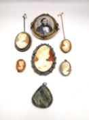A collection of five oval carved shell cameo brooches a double sided swivel rolled gold portrait