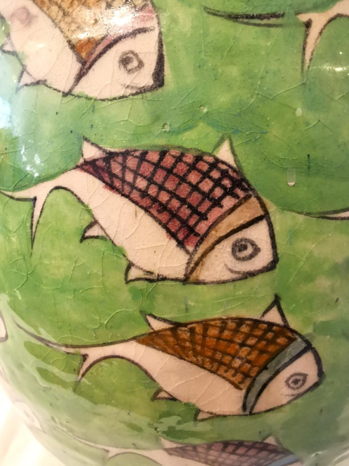 A large twin handled Persian Iznik ceramic vase with green ground and painted fish. H.54 D.25cm. - Image 12 of 12