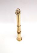 A 9ct yellow gold cigar piercer. Stamped 9ct. H.7cm Weight 6.6g.
