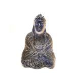 A 19th century faience blue and amber glaze ceramic Buddha statue. H.33 W.24 D.16cm.